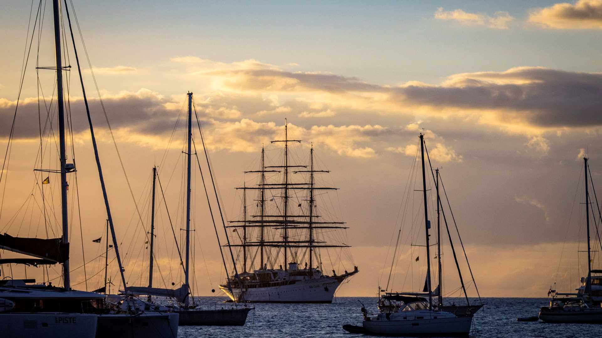 Sailboats at anchor in Admiralty Bay off Port Elizabeth, Bequia, at sunset