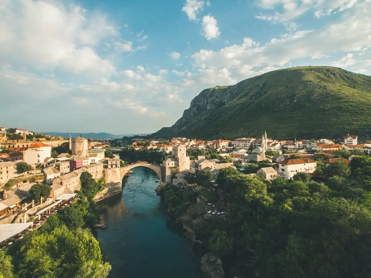 Stari Most bridge over the turquoise Neretva River in Mostar, Bosnia and Herzegovina, at golden hour
