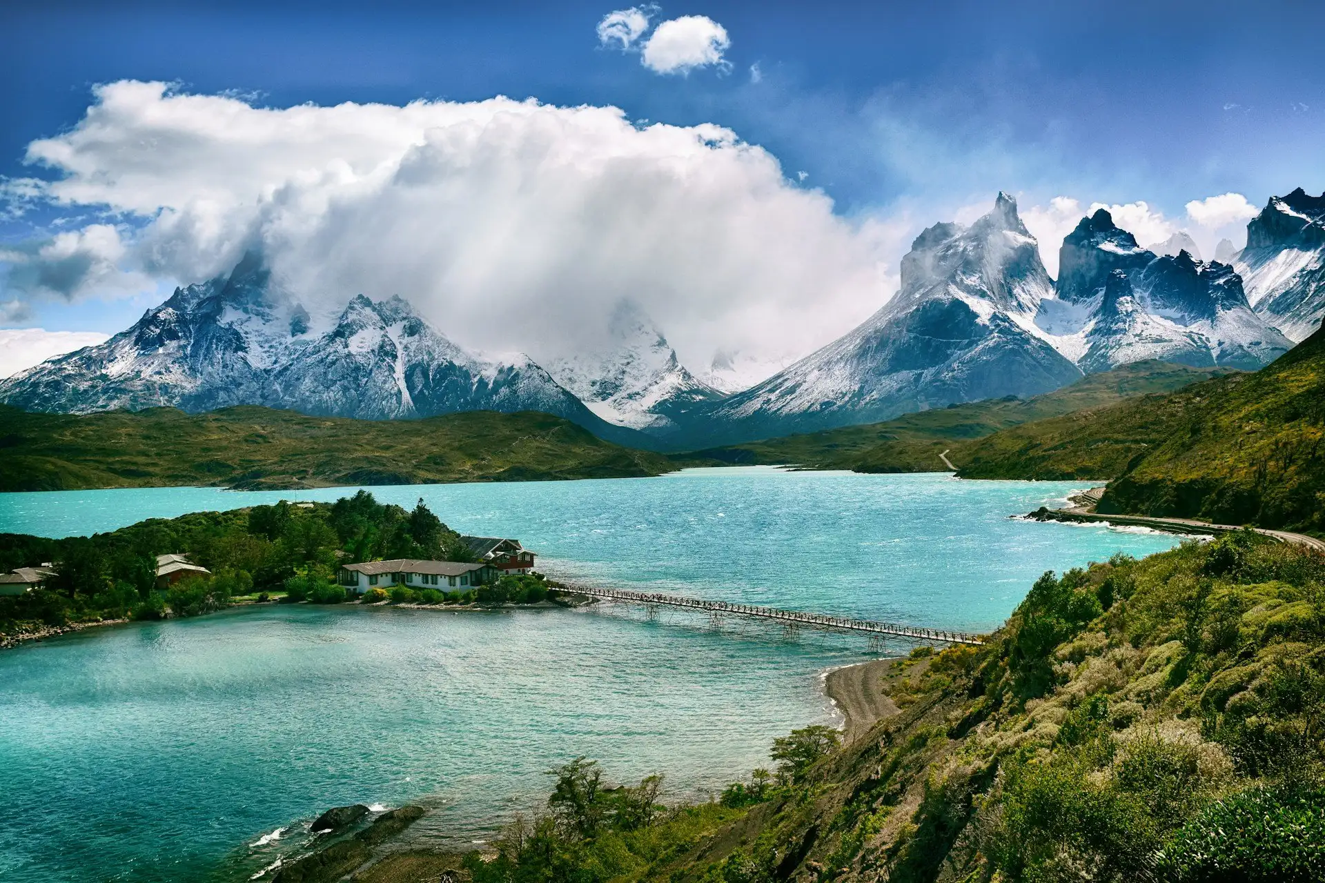 Torres del Paine National Park at sunrise — the three granite towers of the Paine Massif reflected in Laguna Amarga, Patagonia, Chile