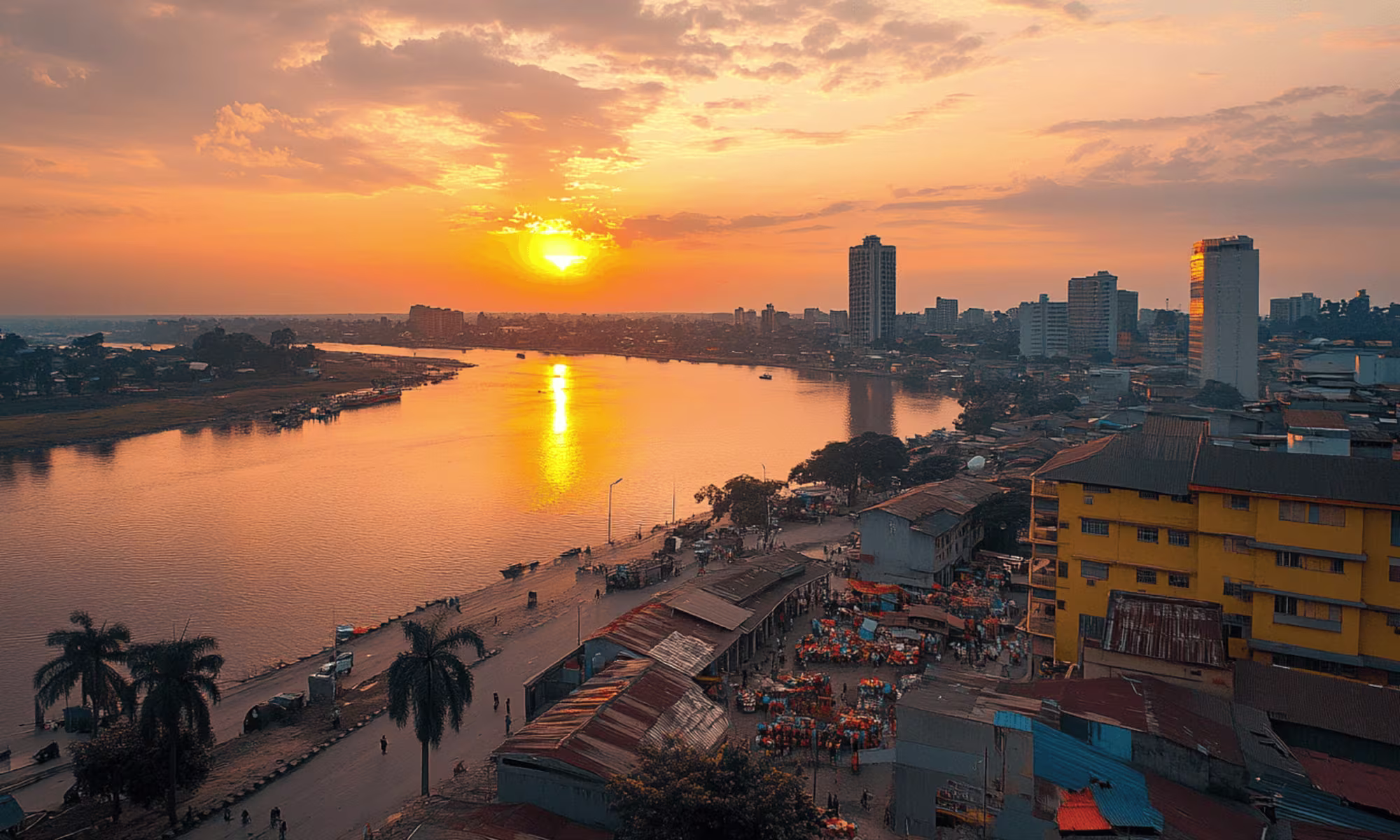 View across the Congo River from Brazzaville's La Corniche toward the skyline of Kinshasa