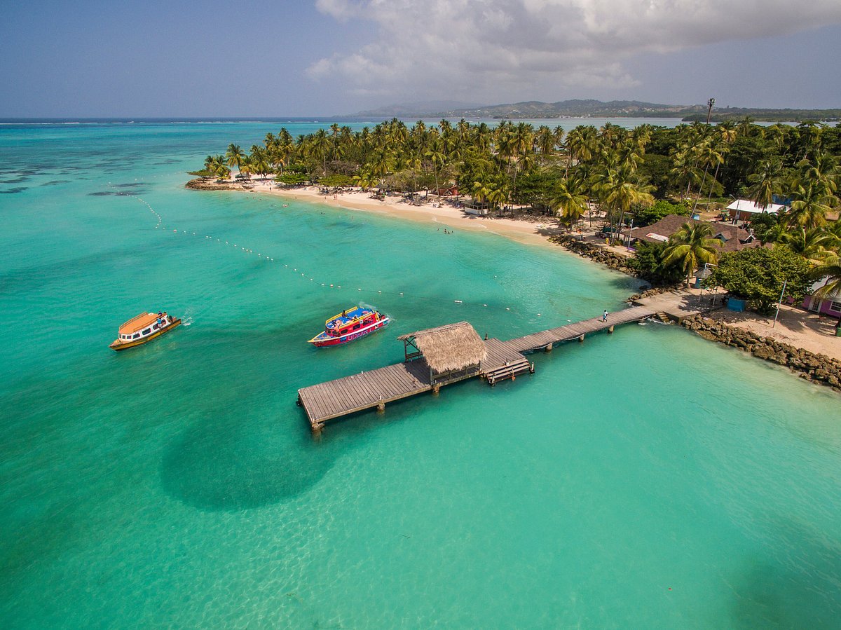 Pigeon Point's thatched jetty over turquoise water near Crown Point, Tobago