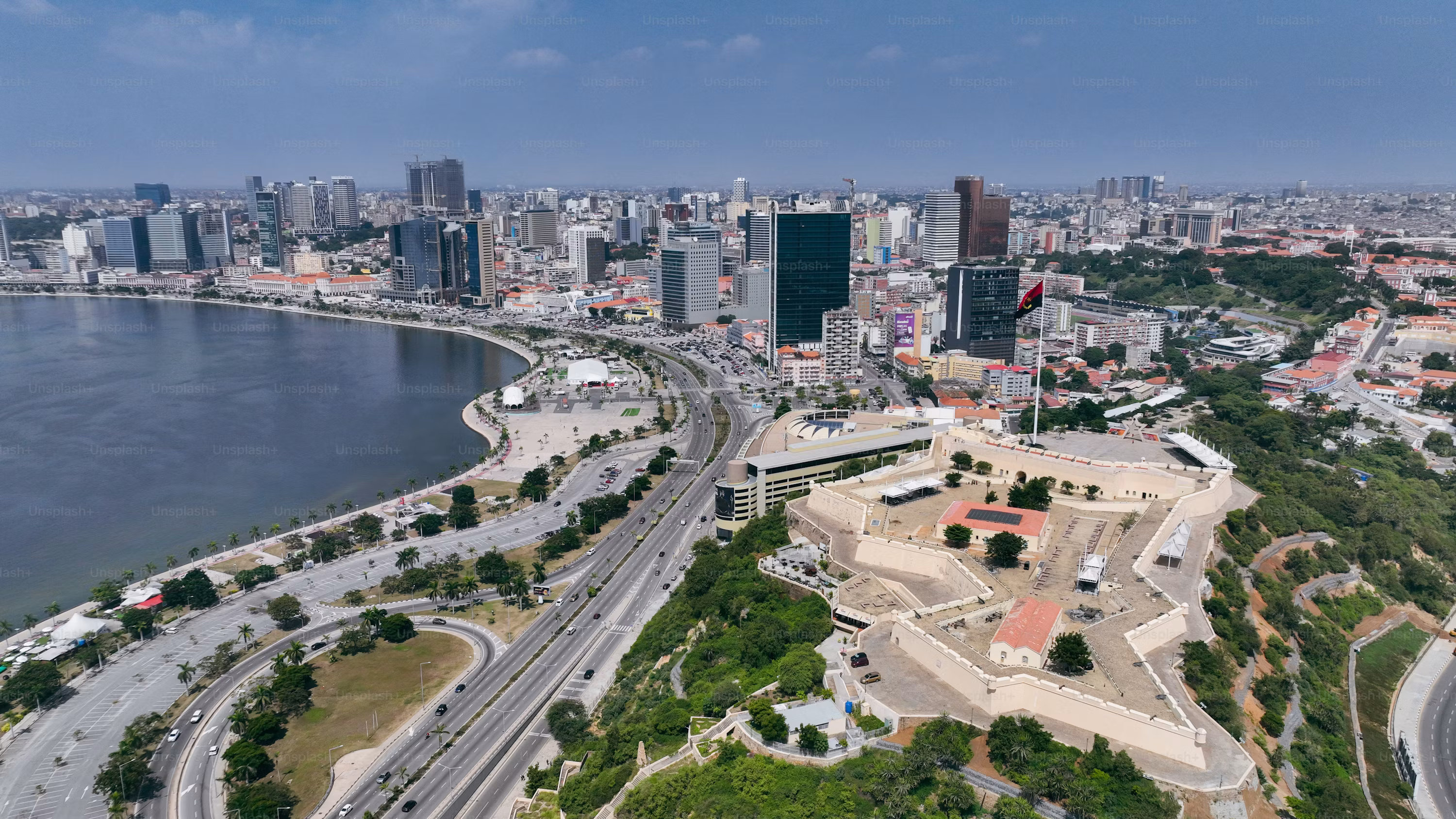 Luanda's Marginal waterfront and skyline along the Bay of Luanda at dusk