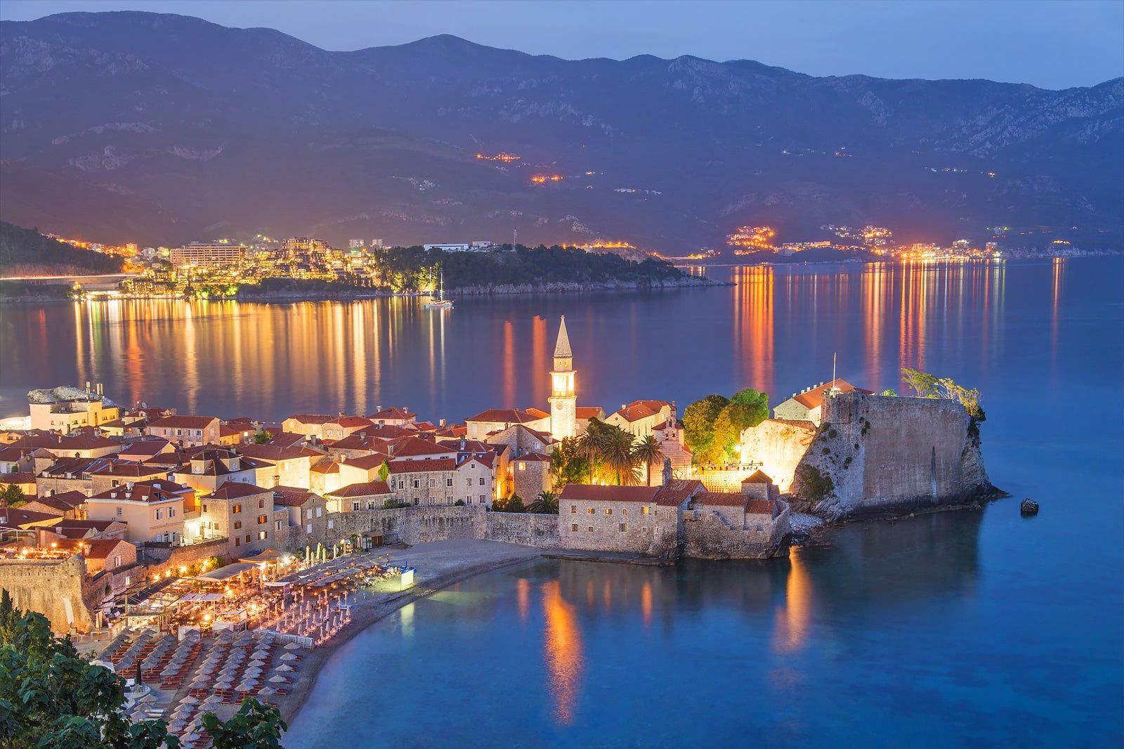 Bars and restaurants lit up in Budva old town, Montenegro, at night