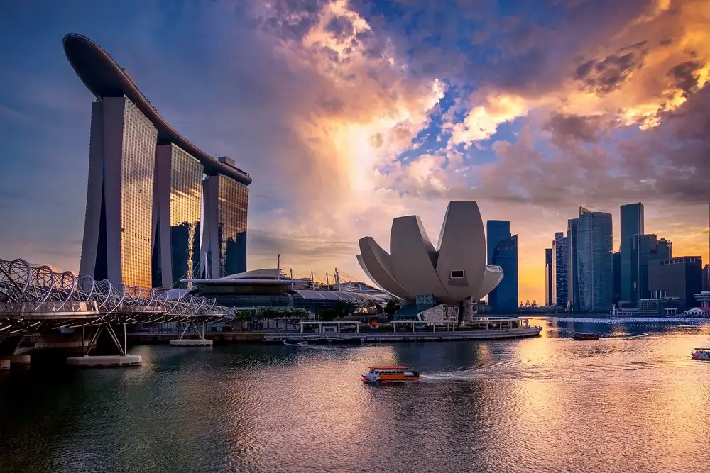 Marina Bay Sands and the Singapore skyline reflected in the bay at blue hour